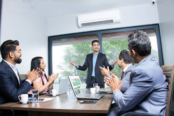 Business team applauding a presentation